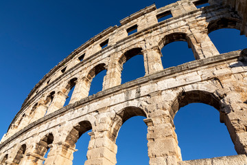 Obraz premium The Roman Colosseum and amphitheater ruins, located in Pula, Croatia, Europe