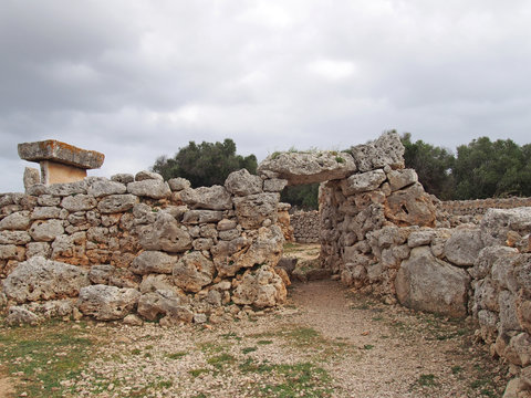 The Talaiotic village of Trepuco Minorca Balearic Islands showing the large taula and surrounding stone wall with entrance