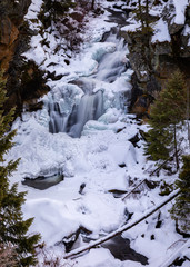 Fototapeta na wymiar Crystal Falls waterfall in snow and ice