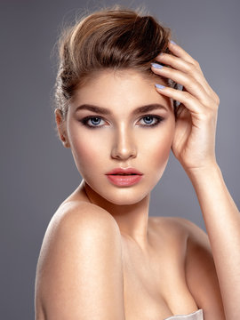 Beautiful face of young caucasian woman with health skin