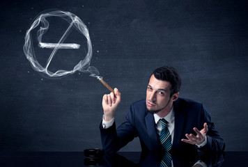 Businessman smoking cigarette and the smoke forms a no smoking sign.