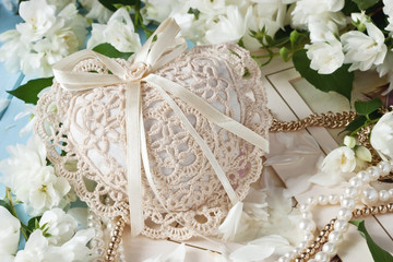 Composition with jasmine flowers and decorative heart -  March 8, valentine's day, mother's day, bridal theme
