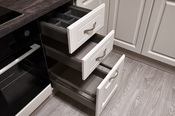 An open drawers in the kitchen table