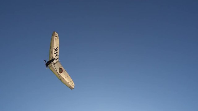 Fethiye, Turkey - 19th of October 2017: International Air Games on the Calis beach - 4K Birdman  hovers in the sky and flies over people
