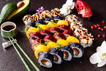 Rainbow Sushi set with salmon, eel, tuna, avocado, royal prawn, cream cheese Philadelphia, caviar tobica, chuka. Sushi menu. Japanese food