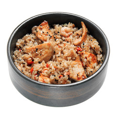 Rice with fried chicken, shrimps, vegetables and sesame in the black bowl. Isolated on white background.