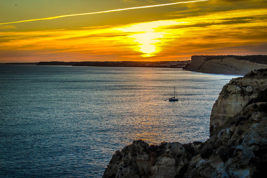 Ocean Sunset and Boat in distance