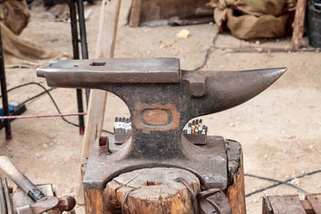 outdoor scene with an old anvil on foreground