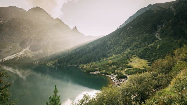 Tatra National Park, Poland. Famous Mountains Lake Morskie Oko Or Sea Eye Lake In Summer Evening. Beautiful Sunset Sunrays Above Tatras Lake Landscape.