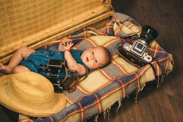 Ready to practice. Family. Child care. Small girl in suitcase. Traveling and adventure. Sweet little baby. New life and birth. Portrait of happy little child. Childhood happiness. Photo journalist