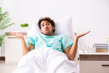 Young handsome man staying in hospital 