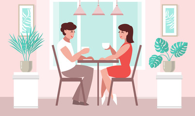 Lovers woman and a man at a table in a cafe. 