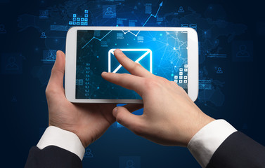 Elegant hand using tablet with online office kit concept
