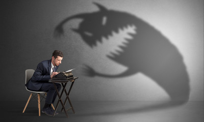 Little hard worker afraid of scary monster shadow
