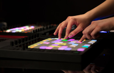 Fototapeta premium Dj hand remixing music on midi controller 