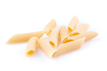 Raw feathers macaroni. Italian pasta close up on the white background