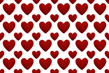Fototapeta na wymiar Love theme seamless pattern with red felted hearts. Valentine's day background with different size hearts on white. Design for decoration, gift wrapping paper, covers, textile.