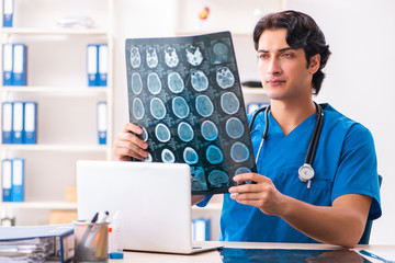 Young male doctor radiologist working at the clinic 