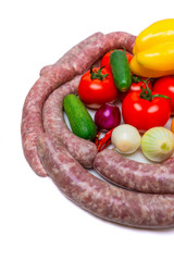 Assorted raw sausage for barbecue with vegetables.