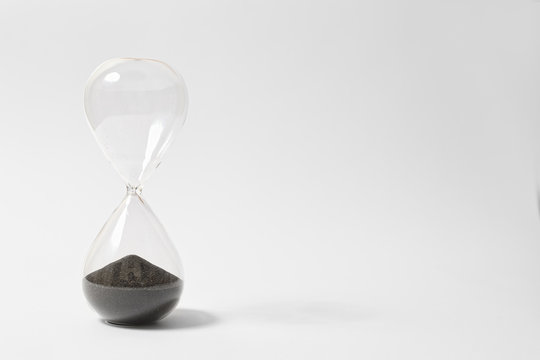 Hourglass On White Background Showing Time's Up, Countdown Is Over,The End