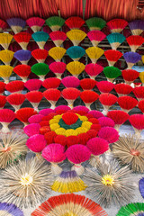 Fototapeta na wymiar Incense colourful sticks in Hue market, Vietnam