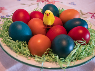 Fototapeta na wymiar easter eggs in basket with little chick