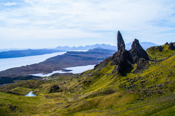 Travel Europe, Scotland, Highlands, Isle of Skye (Tourist popular destination). Scenic mountain landscape view of The Old Man Of Storr attraction, sharp rocks and lakes on background in summer time.