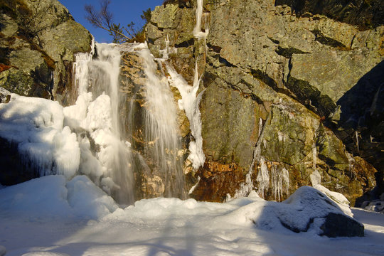 Little waterfall in mountains.