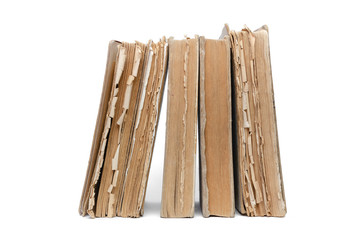 Stack of aged books isolated on a white background.
