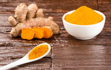 Roots and turmeric powder - Curcuma longa