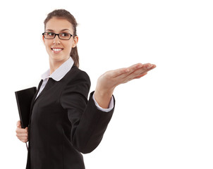 Young beautiful businesswoman or assistant gesturing and holding notebook note pad