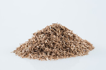 Pile of wood smoking chips isolated on white.