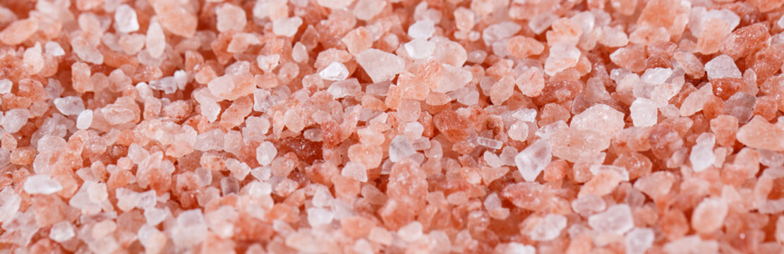 Pink himalayan salt isolated on white background.