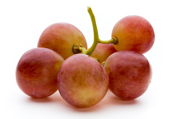 Ripe red grape isolated on white.