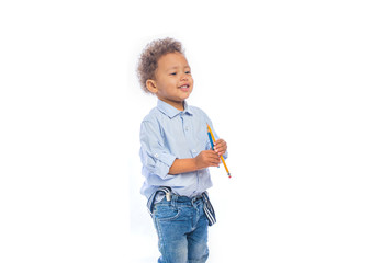 Happy child holding Christmas presents on a background. Christmas time. Children's birthday.