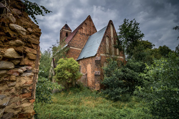 Abandoned church standing in the middle of the forest, completely empty.