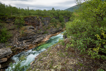 Fototapeta na wymiar River in mountain canyon in Sweden