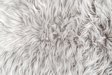 White fur for background or texture. Fuzzy white fur plaid. Shaggy blanket background. Fluffy fake...