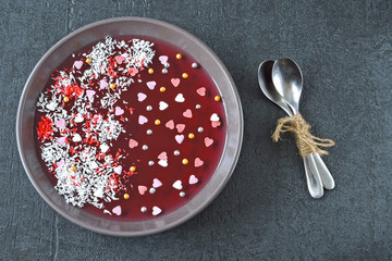Dessert for Valentine's Day. Bowl of marmalade decorated with hearts.