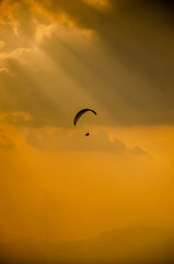 Paragliding in the sky,Paraglider taking off in front of spectacular mountain scenery