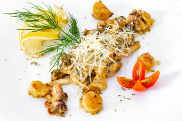 Appetizing, juicy, seafood on a white plate, a dish for the menu and advertising.
