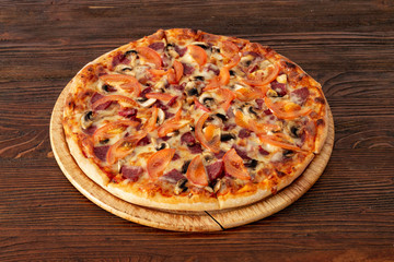 Bavarian pizza with sausages and mushrooms, juicy tomatoes and Parmesan