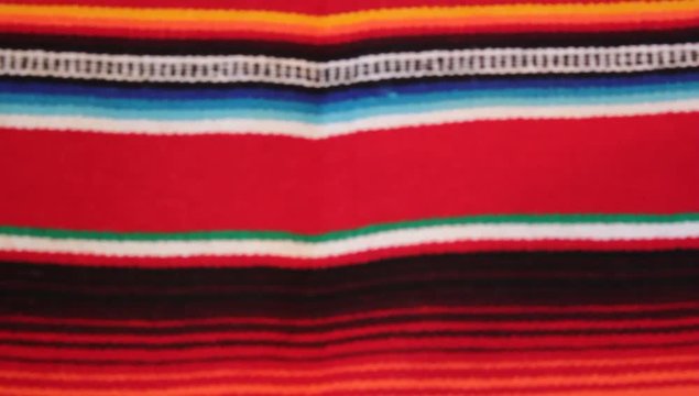 Mexican poncho panning serape background with copy space - stock travel footage 