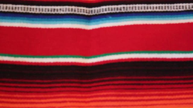 Mexican poncho blanket serape Mexico panning serape background with copy space - stock travel footage 