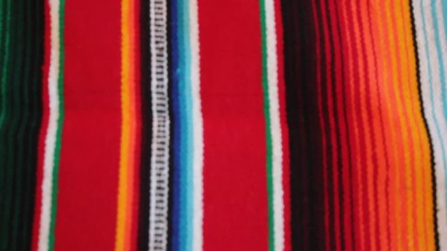 Mexican poncho blanket serape Mexico panning serape background with copy space - stock travel footage 