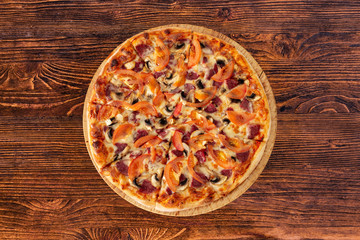 Bavarian pizza with sausages and mushrooms, juicy tomatoes and Parmesan