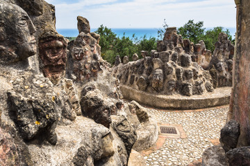 Heads engraved on the rocks at Castello Incantato (Enchanted Castle), a spectacular outdoor artwork constructed by Filippo Bentivegna near Sciacca, Sicily, Italy - obrazy, fototapety, plakaty