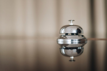 service bell on the hotel reception desk with copy space