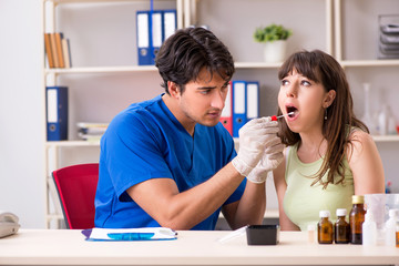 Doctor getting saliva test sample in clinic hospital