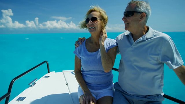 Mature couple on sail boat having fun Bahamas